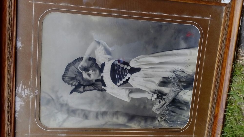 Hand-painted portrait photograph from the early 20th century, over 100 years old, original, with change visible64575361516546120