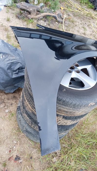 Błotnik prawy Touran l czarny przedlift