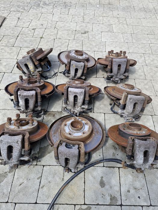 супорт задній диск тормозний Opel Astra H Zafira B