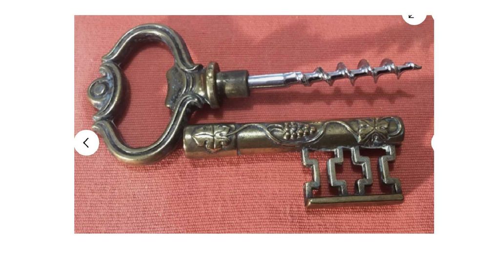Vintage key-shaped corkscrew with vine leaf hook431393489835806723