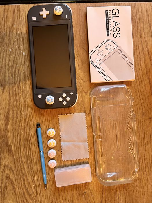 Nintendo switch lite + smerfy więzień zielonego kamienia 2