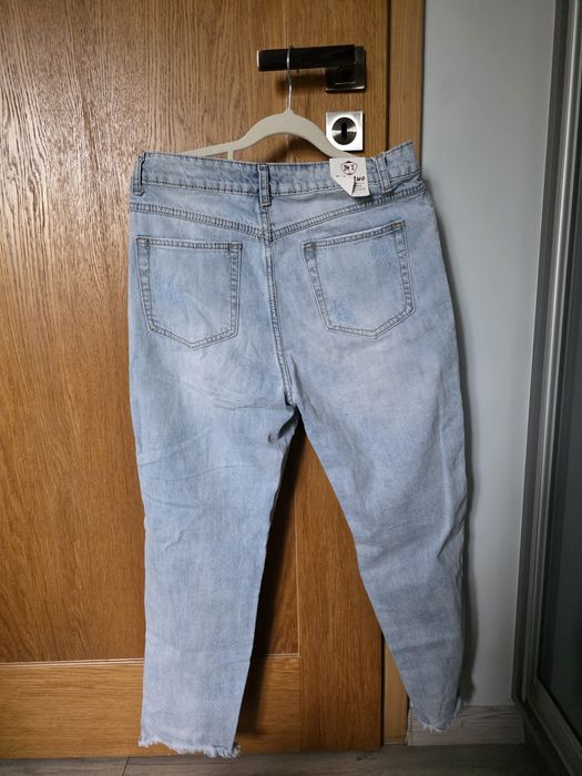 Nowe spodnie jeansy dziury zipki modne