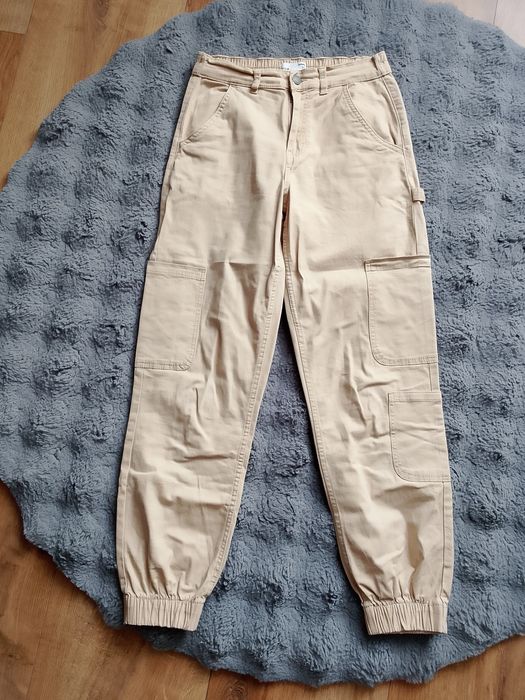 Spodnie z kieszeniami Sinsay beżowe 34