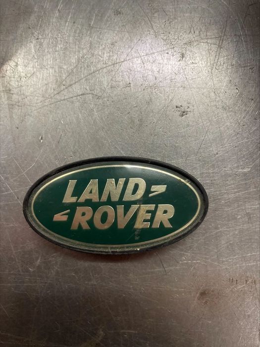 Land Rover DISCOVERY Logo puxador porta mala FVH100110 emblema