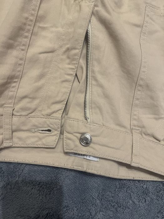 Spodnie z kieszeniami nadzytymi z boku