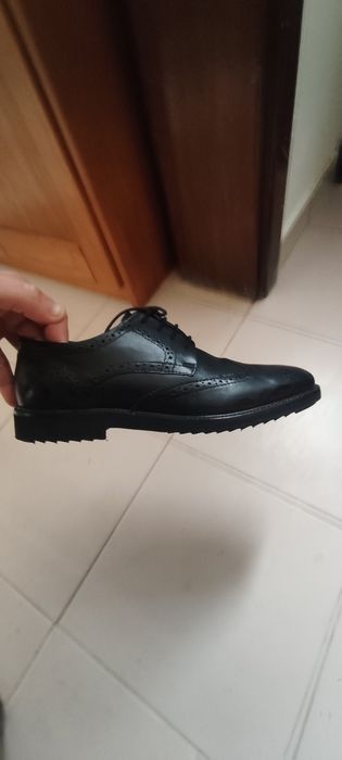 Calçado de homem em pele