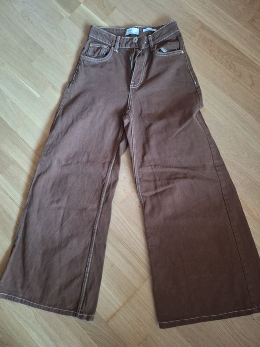 Damskie jeansy dzwony Bershka 32