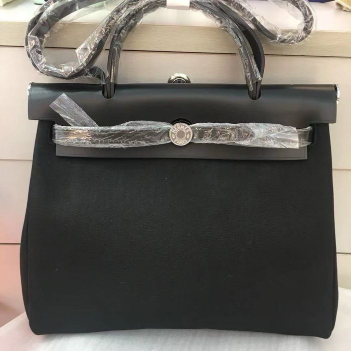 Шикарна шкіряна сумка з текстилем herbag