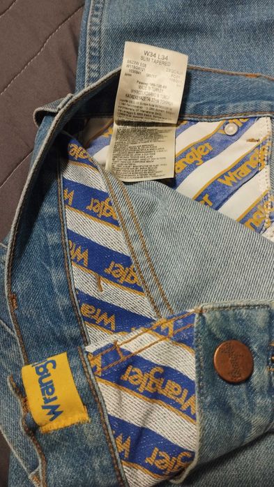 Spodnie męskie niebieskie Wrangler 100% cotton Slim Tapered