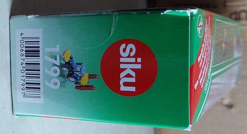 Trator  New Holland T7070 com Pulveizador Kverneland - SIKU 1799