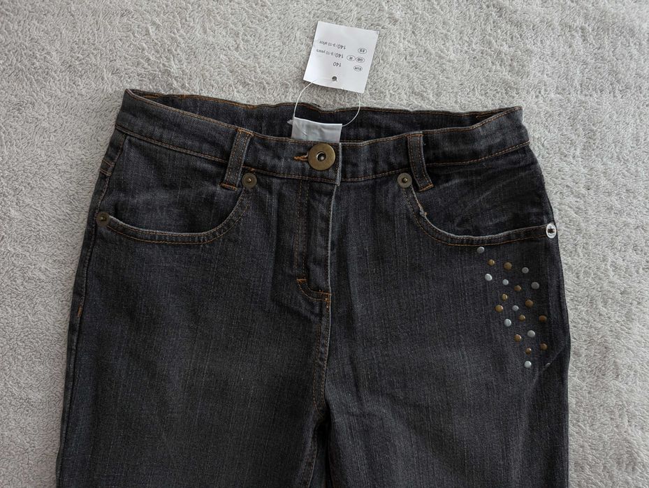 Nowe szare spodnie jeansowe jeansy z ćwiekami dżetami Pulcino 140