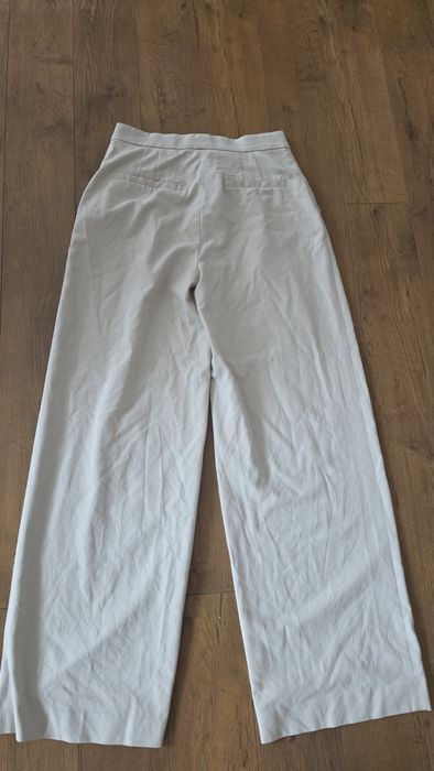 Spodnie eleganckie szeroka nogawka beżowe H&M