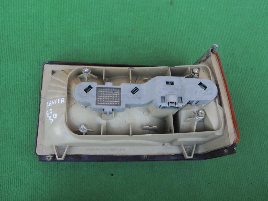 Lampa tył tylna lewa europejska Mitsubishi Lancer 2 II 79,80,81,82,83