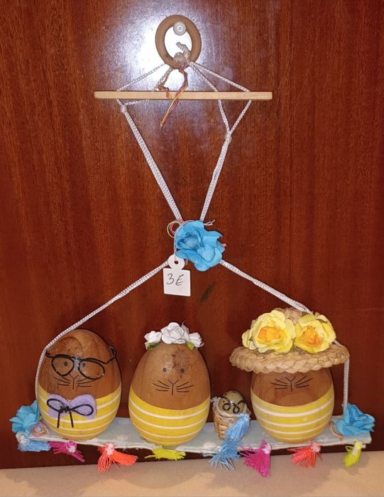 Familia de ovinhos em baloiço