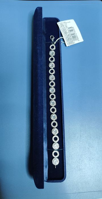 Срібні браслети з золотими вставками.