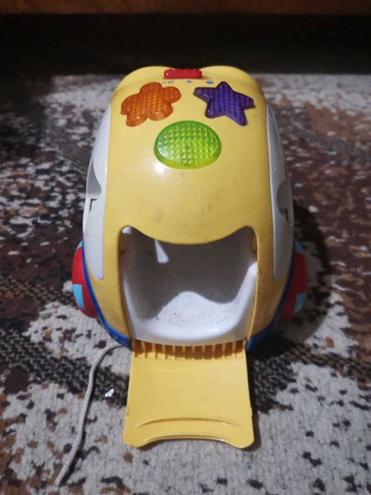 Детская машинка с глазками с грузовых открывающимися отсеком.