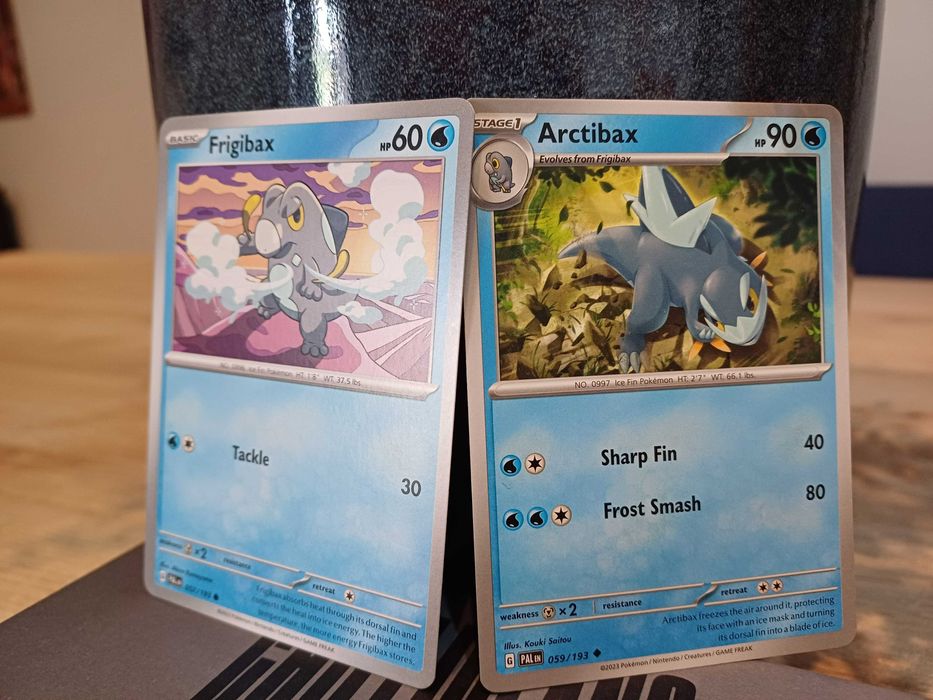 2 Pokémon Cards: Frigibax #57 and Arctibax #5964730017597569121
