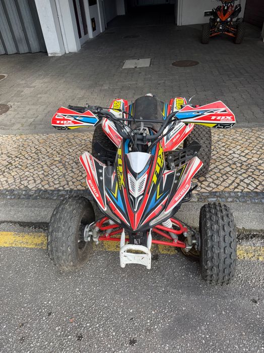 Moto 4 criança  com mudanças e marcha a traz