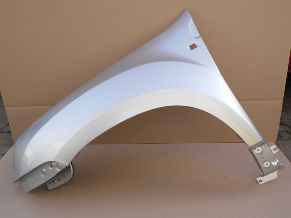 Dacia Duster 10-17 lewy błotnik szary D69