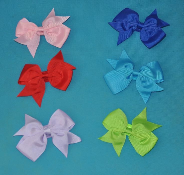 Nowa Opaska na gumce z kokardą dla małej damy.