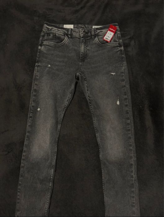 nowe szare jeansy z metką