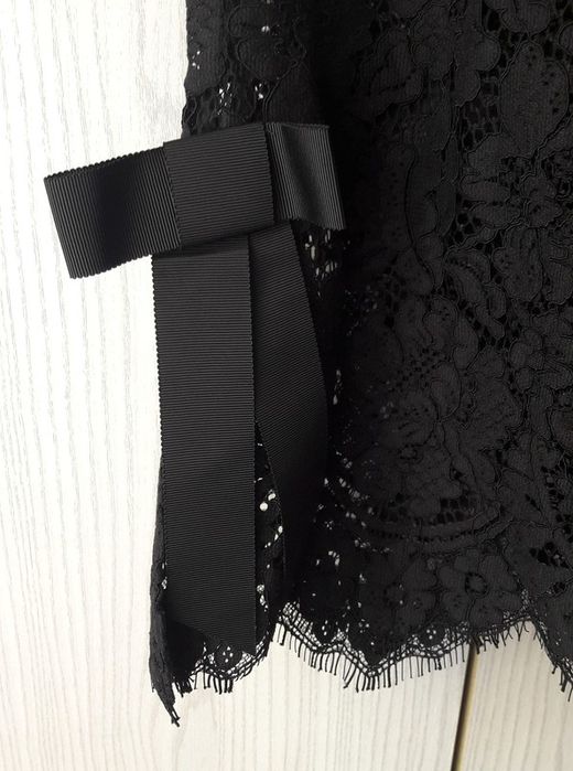 Czarne eleganckie prześwitujące spodnie Ganni koronkowe koronka kwiaty