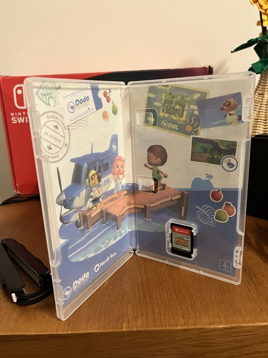 Nintendo Switch com Mario odyssey e Animal Crossing