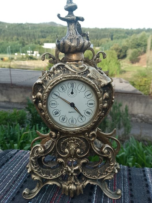 Estatueta de mesa com relógio Reguladora