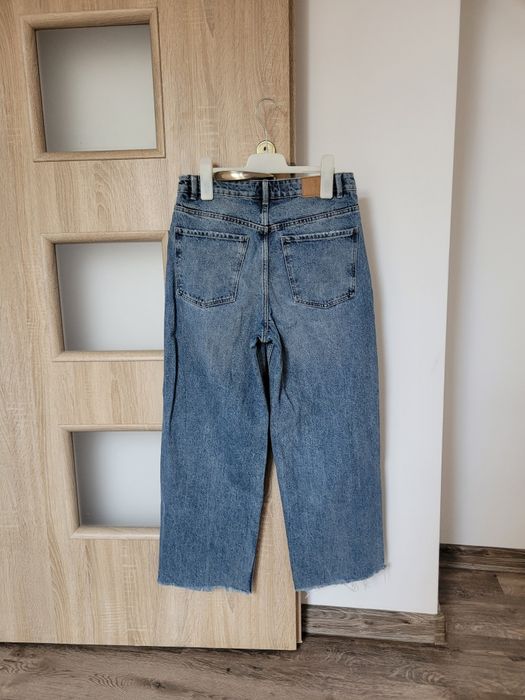 House jeansy z dziurami straight M