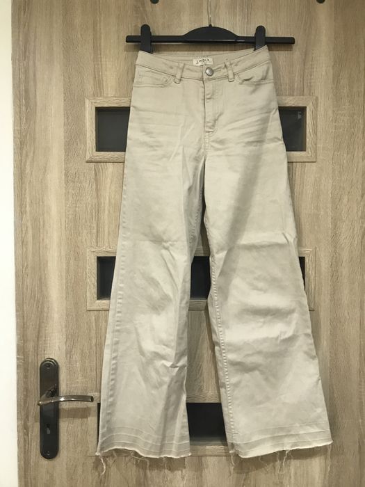 Spodnie 140 beżowe nowe