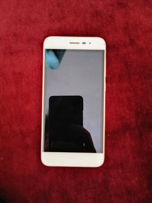 Телефон Coolpad E561