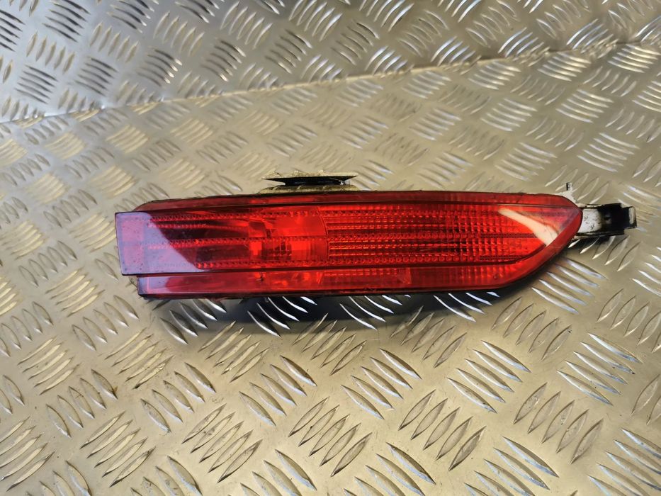 VW TOUAREG 7P 10-18R LAMPA TYL ZDERZAK PRAWA 7P6945702
