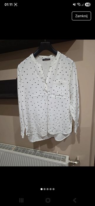 Biała bluzka na guziki w trójkąty