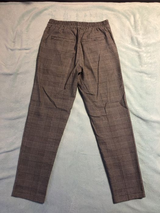 Szare spodnie eleganckie w kratkę szerokie