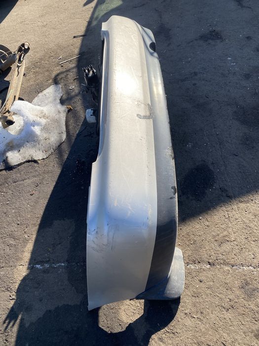 Бампер задний mazda 323ba седан