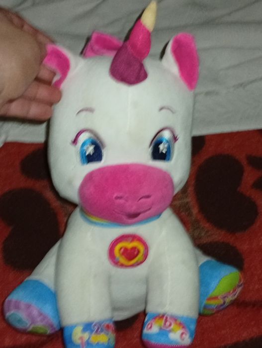 Unicórnio da baby clementoni muito bem funcional