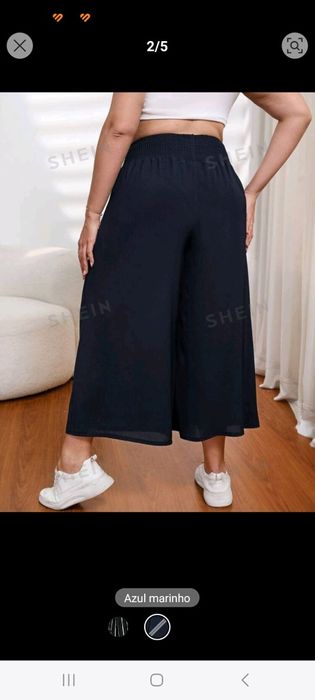 Calças largas de tecido