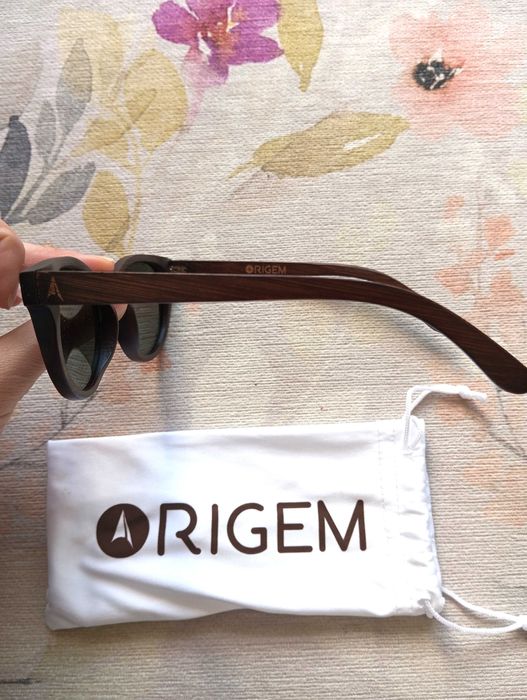 Óculos de sol castanhos Origem