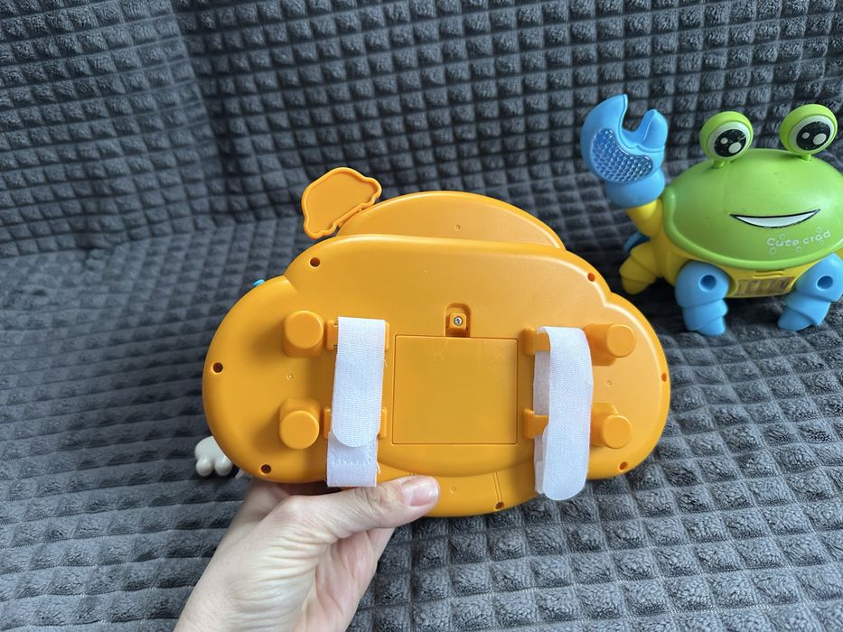 Музичний руль на коляску, танцюючий крабік, іграшки