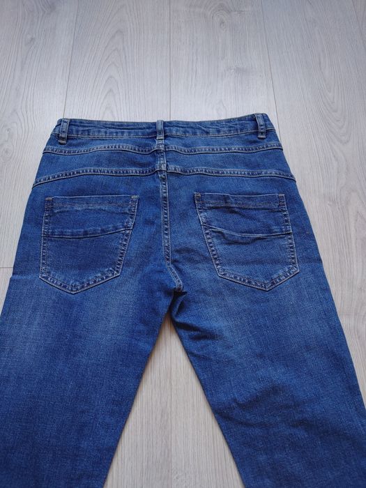 Niebieskie jeansy damskie rybaczki XS 34