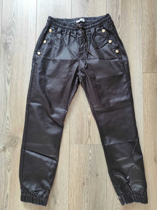 Nowe woskowane spodnie czekoladowe L