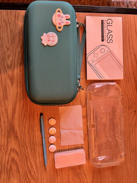 Nintendo switch lite + smerfy więzień zielonego kamienia 2