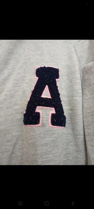 casaco cinzento criança