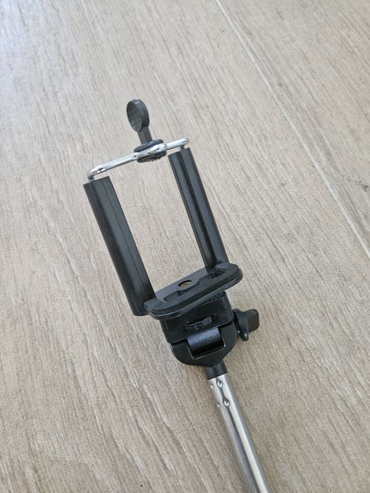 Selfie stick tira fotos smartphone