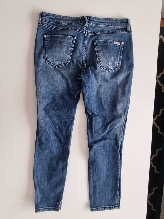 Spodnie z dziurami River Island 38(M)