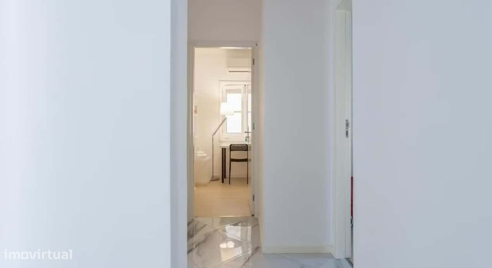 Superior room with shared bathroom and a sofa