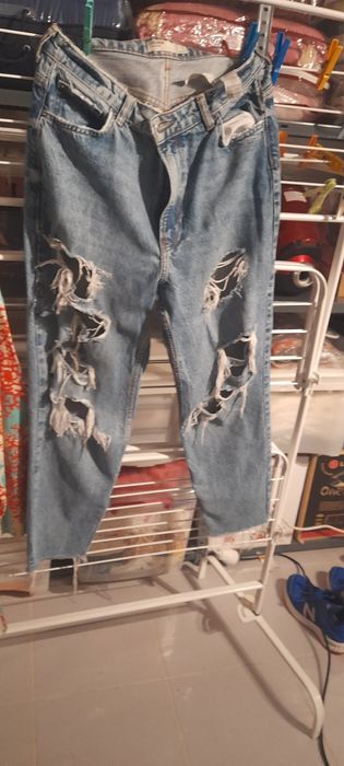 Calças de ganga rotos