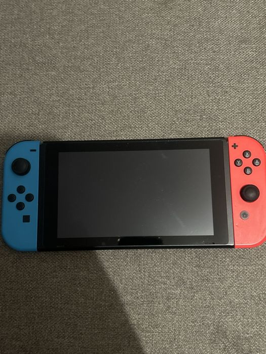 Nintendo switch + torba + 4 gry