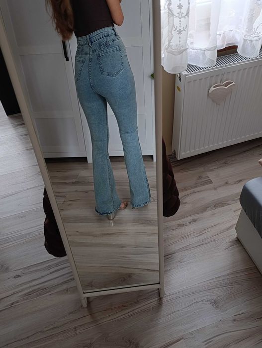 Spodnie jeansowe wysoki stan dzwony rozcięcia spodnie jeansowe