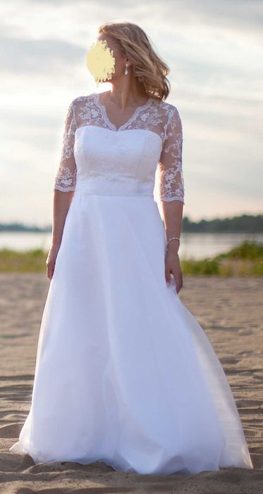 Biała suknia ślubna dla osoby z dużym biustem